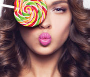 Thumb_1000-woman-eating-lollipop