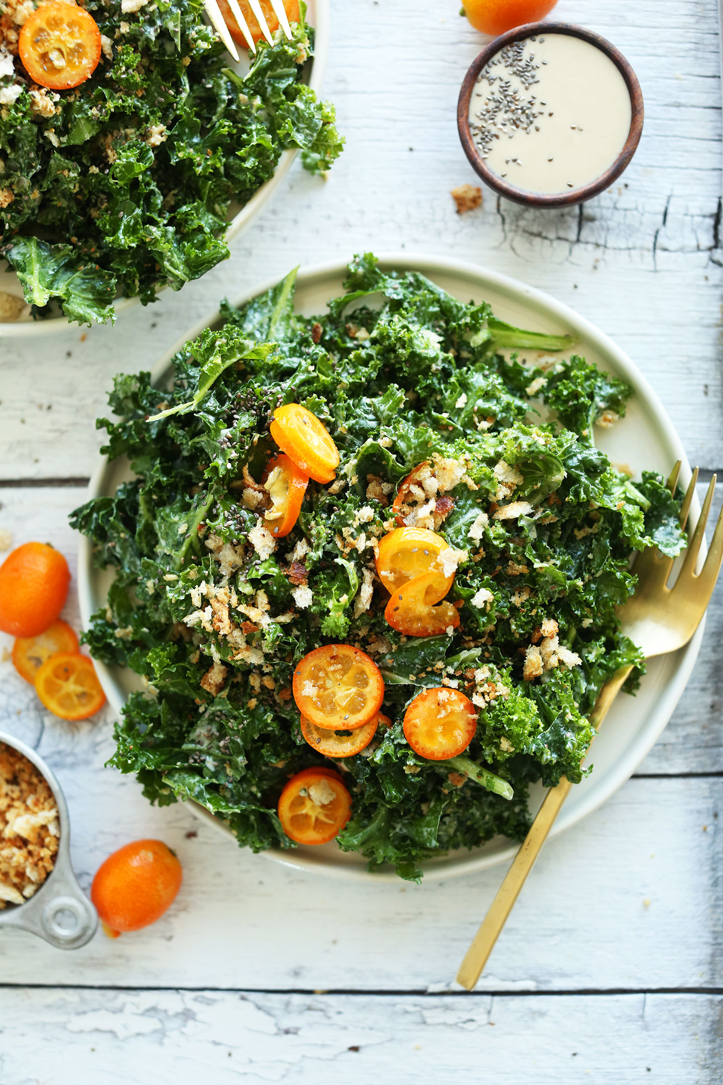 Healthy-simple-kale-salad-with-kumquats-chia-seeds-and-a-quick-tahini-dressing-so-satisfying-and-quick-vegan-recipe-salad-healthy-kale-minimalistbaker